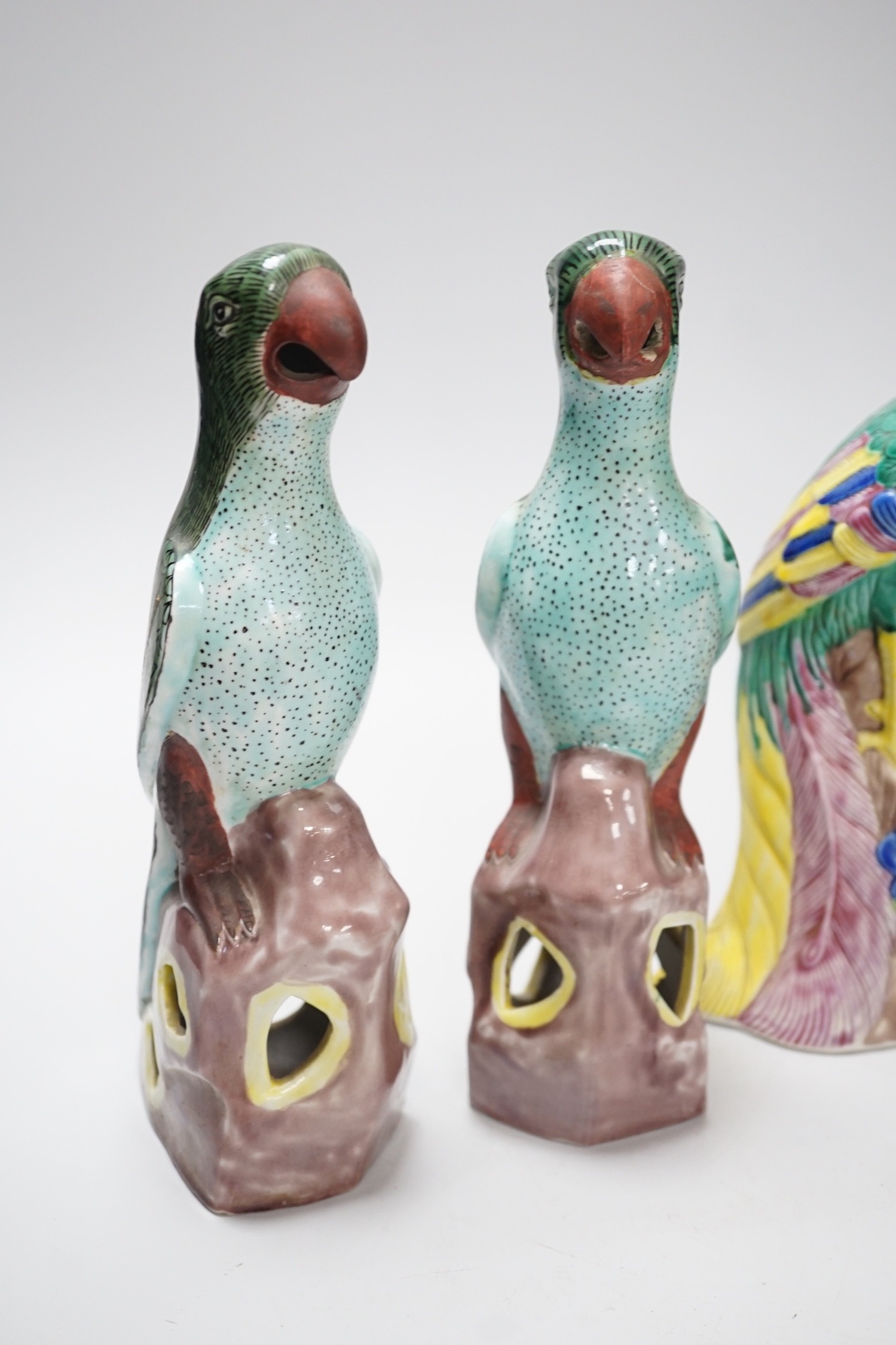 A pair of Chinese polychrome porcelain pheasants and a pair of parrots, tallest 27cm